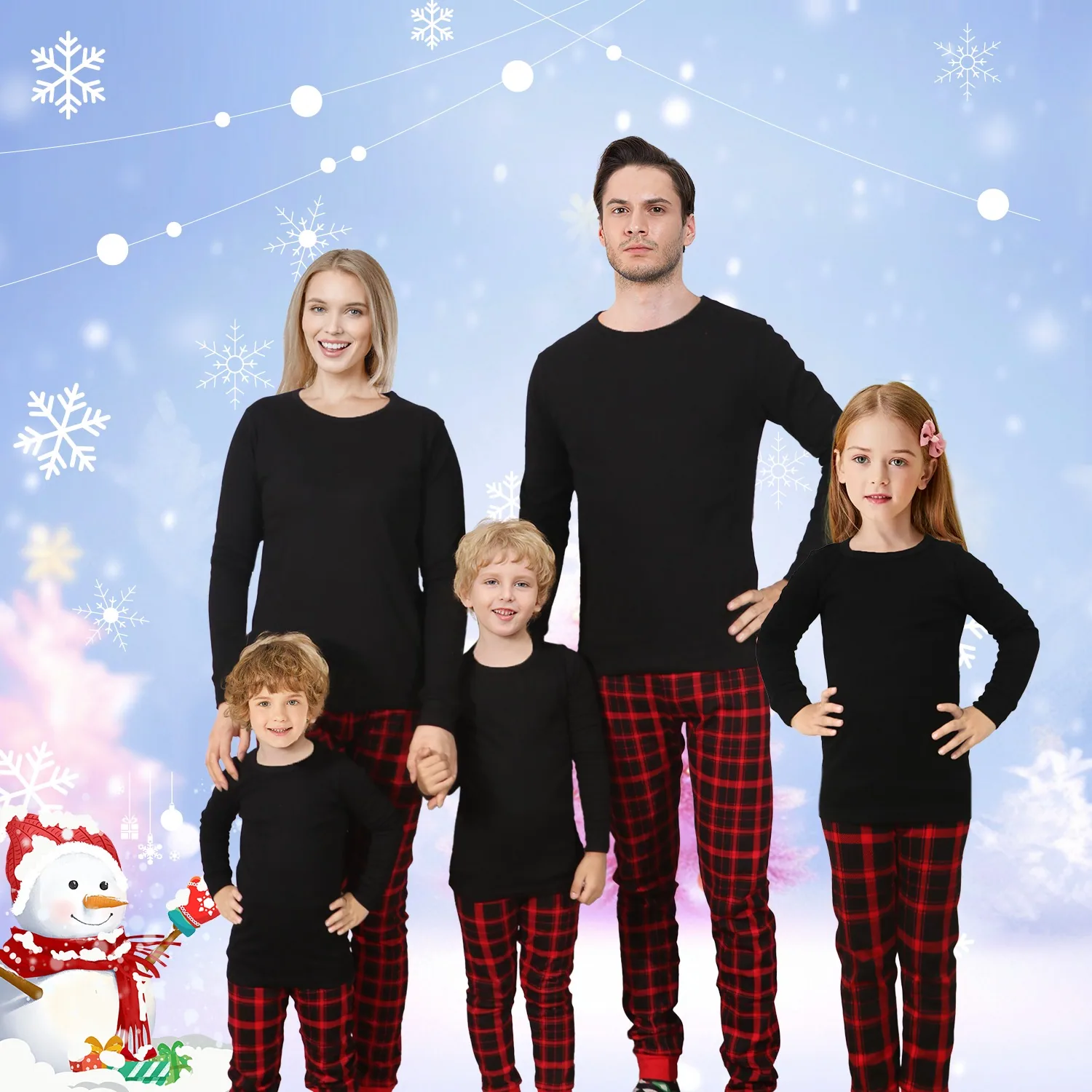 A family of five photographed together in matching Family Feeling pajamas